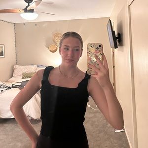 Women’s black ruffle sleeved tank top